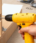 Heavy Duty Cordless Electric Drill Kit With Ergonomic Soft Touch Grip And Rapid Bit Exchange in use, drilling a screw into wood.