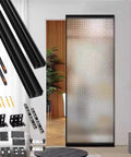 Trackless Concealed Barn Door Kit With Soft Close Mechanism And Invisible Ghost Hardware For Seamless Sliding Doors Fits Sixty Inch Wide Openings kit components beside frosted glass door.