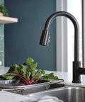 Three-Function Pull-Down Kitchen Faucet With POWERinse Technology Delivers Extra Cleaning Power, high-arc design in modern kitchen