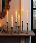 2 Pack Flameless Taper Candles With Remote And Timer, 9.6 Inch Ivory LED Battery Operated Wax Style Candles on a mantel