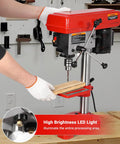 Using 8 Inch Benchtop Drill Press With Laser Alignment, Class II 1mW, Five Speed Control From 620 To 3100 RPM on wooden material.