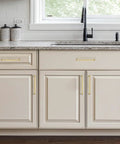 Kickass Brushed Gold Cabinet Handles And Drawer Pulls Made From Solid Zinc Alloy on light kitchen cabinetry with granite countertop