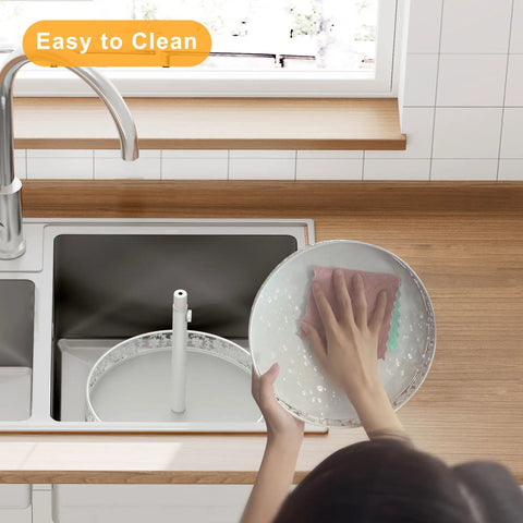 Person cleaning a 12 Inch 2 Tier Lazy Susan Turntable Organizer Adjustable Height Smooth Rotation Kitchen Countertop Spice Rack White.