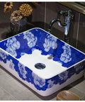 Top Shelf Rectangular Ceramic Vessel Sink With Slick Hand Painted Blue Finish For Above Counter Vanity Setup showcasing floral design.
