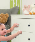 Child reaching for white dresser with 4 Pack Retro Cowboy Boots And Hat Cabinet Knobs Set, Crystal Glass Drawer Pulls, 1.37 Inch Round Kitchen Handles