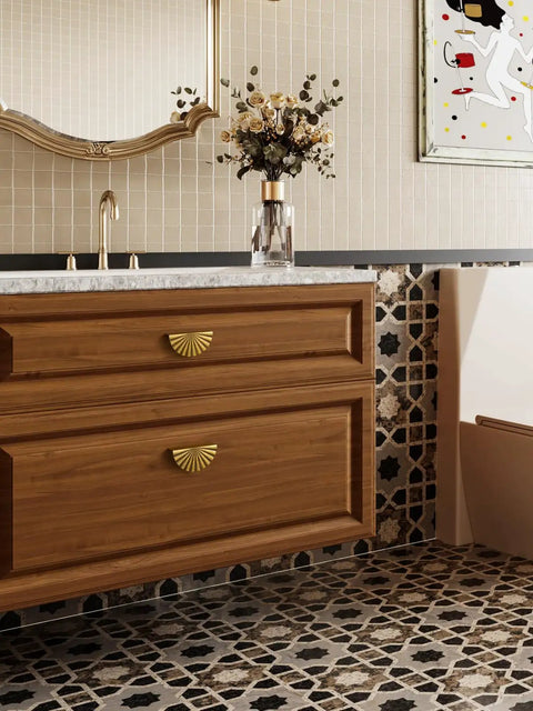 Top Shelf Antique Brass Cabinet Pulls 5 Pack Featuring Sleek Vintage Cup Handles And Built Like A Tank Zinc Alloy Construction For Kitchens Bathrooms And Closets on a stylish vanity with a floral arrangement.