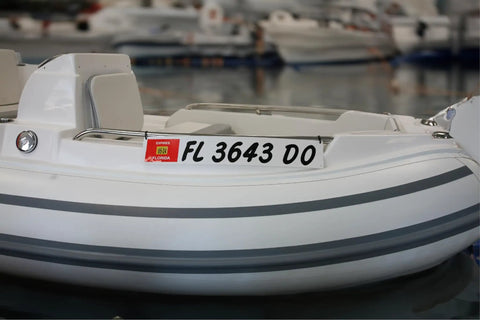 Marine Registration Plate Kit For Inflatable Boats And Ribs No Glue Needed 4 By 24 Inch ABS Mounting Boards With Zip Ties Saltwater Resistant Made In USA Pair installed on an inflatable boat.