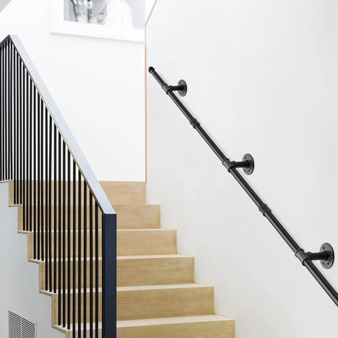 Straight Up Reliable Black Industrial Pipe Handrail Heavy Duty Steel Staircase Banister installed alongside wooden stairs.