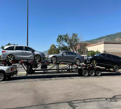 Vehicles secured with 4 Pack Beefed Up Heavy Duty 2 Inch By 10 Foot Wheel Straps With Flat Hooks on trailer for hauling