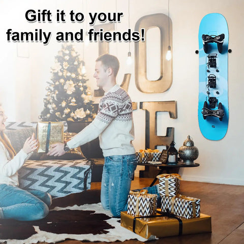 Rock Solid Vertical Ski Hangers And Snowboard Wall Mount Rack Set With Screws And Anchors Premium Black Storage Brackets mounted next to a festive gift exchange.