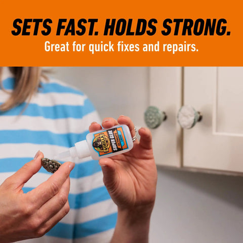 Tough As Nails Super Glue Pack Of Six 15 Grams Tubes Clear Bonding Liquid for quick repairs being applied to a decorative knob.