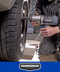 Mechanic uses Beefy 7.5 Amp 1/2 Inch Impact Wrench Delivers 240 Ft-Lbs Torque, 2200 RPM, 2700 IPM With Friction Ring Anvil on car tire