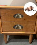 Solid As A Rock Copper Finish Carbon Steel Cup Handles Two Pack featuring vintage style on wooden dresser drawers.