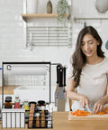 Woman chopping carrots next to Outdoor Grill Caddy With Paper Towel Holder And Utensil Organizer, ideal tailgate gear, in a kitchen.