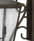 Extra Large Four Light Outdoor Wall Lantern With Built Tough Traditional Scroll Frame And Rust Proof Aged Zinc Finish close-up showing textured glass and frame.