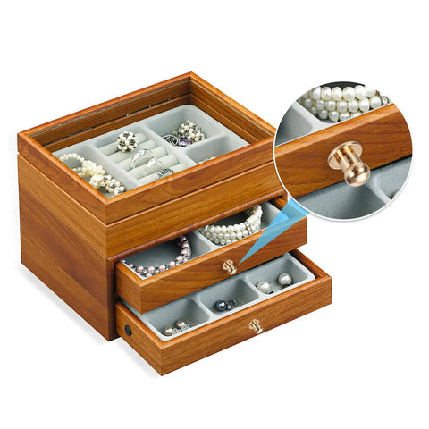 Slick 50 Pack Mini Round Knobs In Sweet Black Zinc Alloy on a jewelry box for stylish organization and updates.