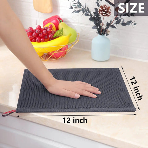 Person's hand resting on 12x12 inch dark grey 100 Percent Pure Cotton Waffle Weave Dish Cloths 6 Pack Ultra Absorbent Honeycomb.