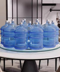 Rock Solid 360 Smooth Swivel Lazy Susan Turntable with 34-inch tempered glass platter displaying water bottles.