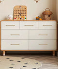 Real Deal Solid Brass Cabinet Pulls With Slick Brushed Gold Finish featured on a stylish dresser with six drawers.