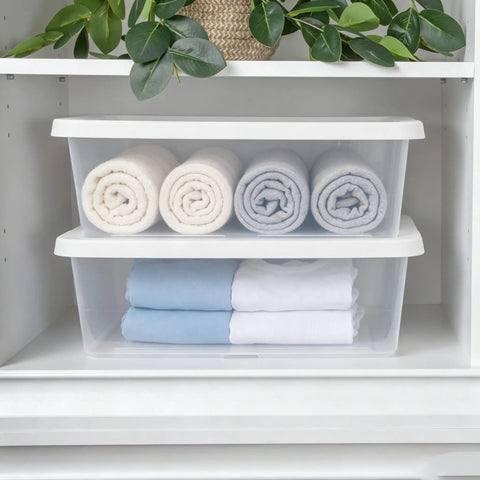 Heavy Duty Clear Plastic Storage Bins With Secure Snap On Lids Super Solid Twelve Quart Capacity Sweet Four Pack storing rolled towels in a closet.