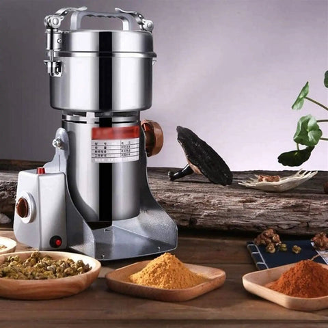 Electric Grain Grinder With Stainless Steel Body, Safety Upgraded, High Speed Spice Mill on wooden surface with spices
