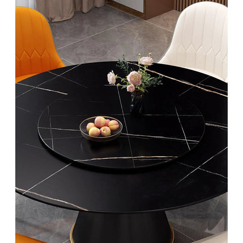 Large Marble Lazy Susan Turntable Rotating Serving Plate For Countertops And Dining Tables on a modern black table with fruits and flowers.