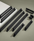 Heavy Duty Square Cabinet Pulls With Knockout Matte Black Finish 10 Pack arranged in various sizes on a surface.