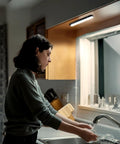 Two Pack LED Light Bars With Motion Sensor, 160 Lumens, Touchless Operation installed under a kitchen cabinet.