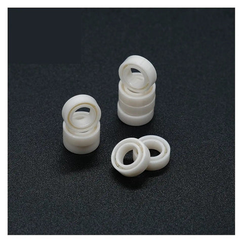 Premium MR74 4x7x2.5 Millimeter Full Ceramic Zirconia Sealed Ball Bearing ABEC 9 set of white ceramic rings.