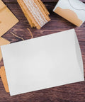 Heavy Duty Epe Foam Wrap Sheets And Expanding Moving Pouches Secure Fragile Kitchenware For Shipping With Shock Absorbing Buffers For No Sweat Household Moves on a wooden surface with craft materials.