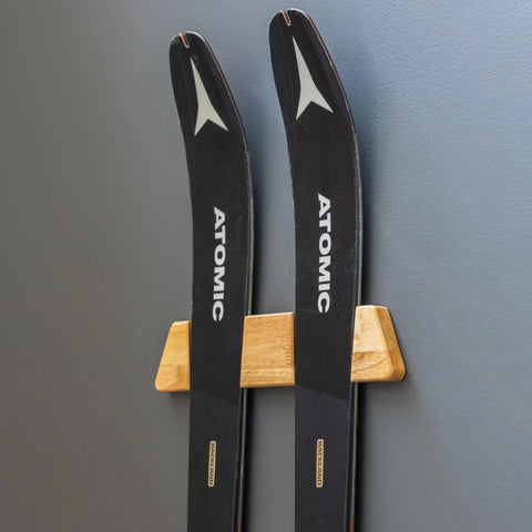 Dope Horizontal Wood Ski Rack Wall Mount With Calibrated Brackets Natural Oak Finish Heavy Duty Storage For Garage Cabin Game Room Holds Fifty Pounds. Two skis mounted on a wood rack.