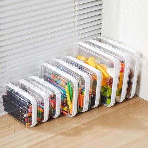 Hella Tough Four Piece Clear Hard Shell Case With Secure Zipper Closure organizing Legos and art supplies on a shelf.
