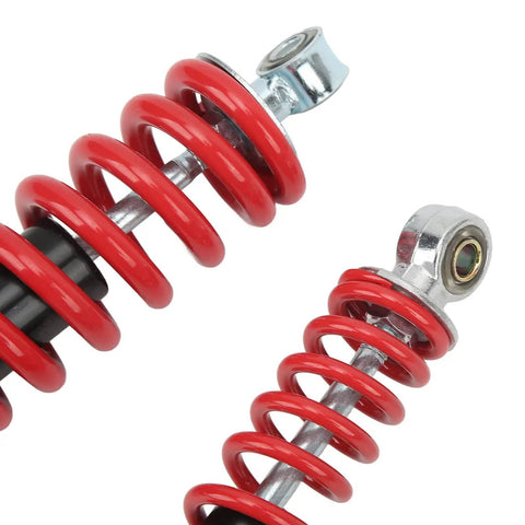 Close-up of red coiled 250mm Adjustable Shock Absorber For 50cc 125cc Dirt Pit Bikes ATVs Go Karts Front And Rear Suspension