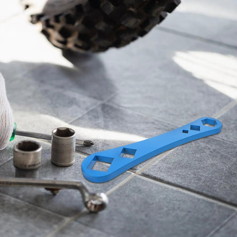 Heavy Duty Oil Drain Screw Removal Tool And 30mm Hexagonal Socket Wrench For Cars on a tiled floor next to socket wrenches.