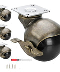 Smooth As Butter Two Inch Antique Brass Swivel Casters With Locking Brakes Set Of Four Vintage Furniture Roller Wheels close-up of a caster.