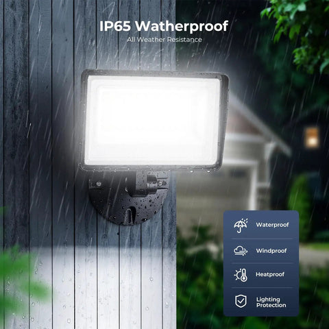 2 Pack 90W LED Flood Lights Outside Hella Bright 9000LM 6500K Daylight White mounted on wall in rain, IP66 waterproof security lighting.