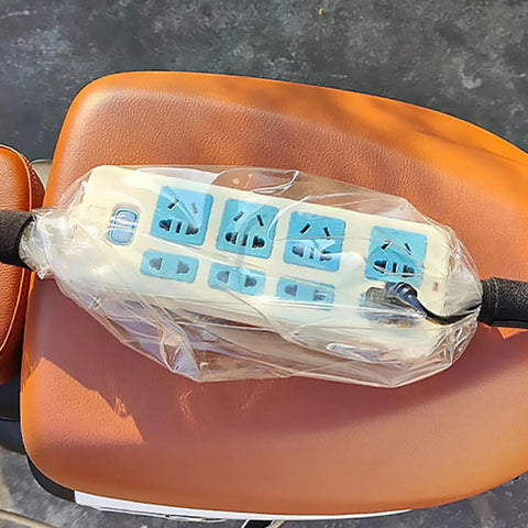 Heavy Duty All Season Road Ready Universal Fit Waterproof EV Charger Cover Shield on brown seat, protecting against rain and ice.