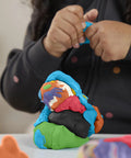 Child sculpting colorful modeling compound, using Forty Two Pack Bulk Mini Modeling Compound Cans For Creative Kids And Rad Little Legends Hella Cool Classroom Prizes Party Favors Back To School Sick Stash Non Toxic Craft Supply Age 2 Plus Vibrant Colors.
