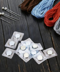 Sixty Four Piece Hidden Sew Magnetic Snap Kit delivers solid hold with PVC sleeves, featuring flat concealed fasteners and sewing supplies.