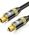 Slick Nylon Braided Toslink To Toslink Optical Audio Cable With Super Durable Gold Plated Ends For Epic Surround Sound On Game Consoles PlayStation Xbox TV And Home Theater Systems 3 Foot Black SPDIF Certified Cable, close-up of gold-plated ends.