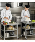 Chefs using Mobile Kitchen Prep Table On Wheels With Adjustable Feet And Locking Casters in restaurant kitchen