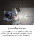 Top view of Solarcycle Morph Desk Light With Adaptive Daylight Tracking on a desk in a creative workspace.