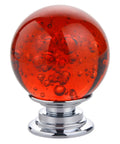 Close-up of a Ten Pack Of Slick Red Crystal Glass Bubble Cabinet Knobs Round Drawer Pulls And Dresser Handles For Kitchen Cupboards With Zero Hassle Mounting Hardware 30 mm Size.