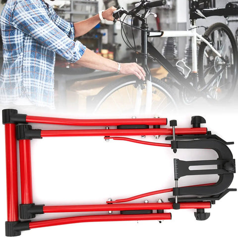 Folded Bike Wheel Truing Stand With Ruler And Thimble, Foldable Aluminum Alloy Build on workshop table with bicycle mechanic
