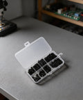 M3 Black Nylon Hex Standoff Spacer Kit With Nuts And Flat Head Screws, 180 Piece Set, Six Lengths From 6mm To 20mm, Perfect For RC Drones FPV Electronics Projects And PCBs, Comes In A Practical Storage Box. Open storage box with black nylon standoffs and screws for PCB and RC projects