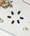 50 Piece M4x6 Stainless Steel Hex Ball Plunger Set Screws tough as nails on a white surface with flowers.