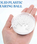 200 Piece Slick POM Plastic Bearing Balls 5 Mm Solid Roller Beads in hand, ideal for drawer glides and smooth sliding hardware.