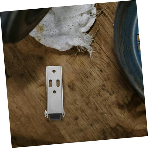 Heavy Duty Vertical Sliding Door Rollers Four Pack For Cabinet Closet Track Guide Smooth Gliding Wheels No Sweat Install Top Notch Premium Steel Hardware Replacement Kit showing a steel pulley mounted on a wooden surface.