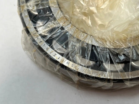 22216 Spherical Roller Bearing With 80mm Inner Diameter and 140mm Outer Diameter Measuring 33mm Wide in protective packaging.