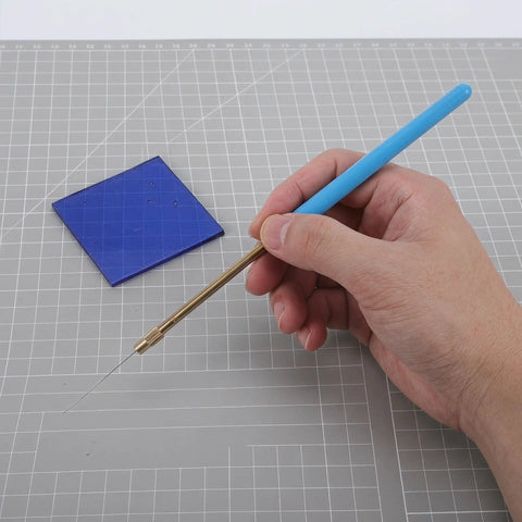 Flame Test Rods Set With Blue Glass Filter Sheet And Metal Alloy Wire for Chemistry Lab Experiments displayed on a grid surface.